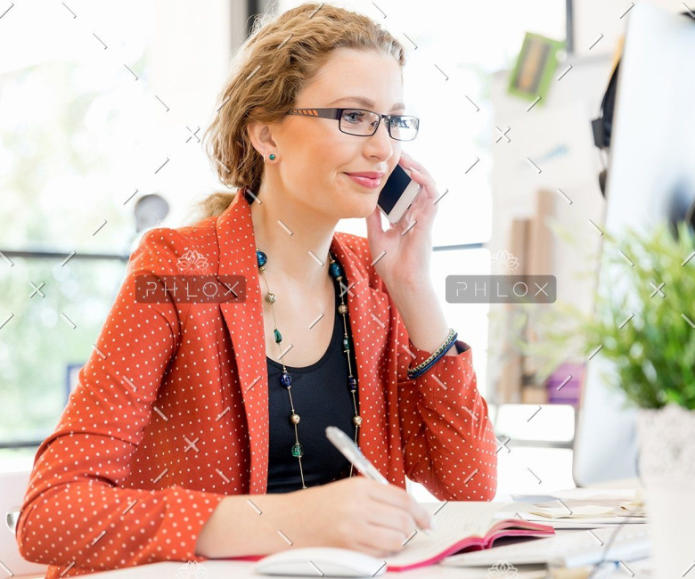demo attachment 138 young woman holding mobile phone in office pe9ardr